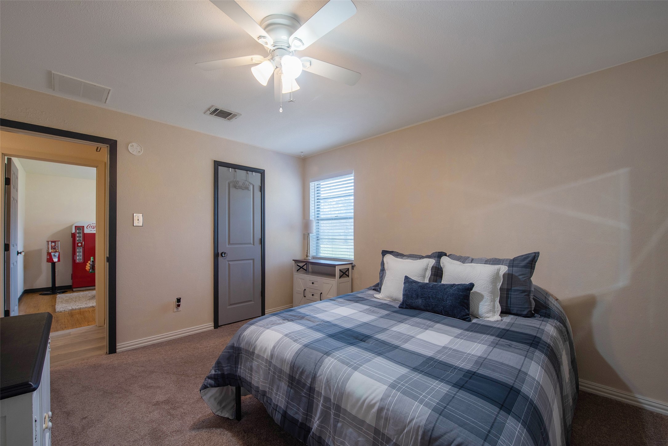 12998 Rocky Road Conroe, TX 77306 - Photo 31 of 50 a bedroom with a bed and a chandelier