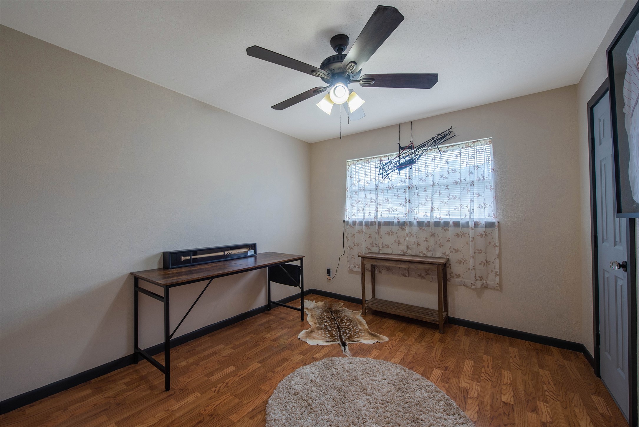 12998 Rocky Road Conroe, TX 77306 - Photo 37 of 50 a living room with furniture and a fireplace