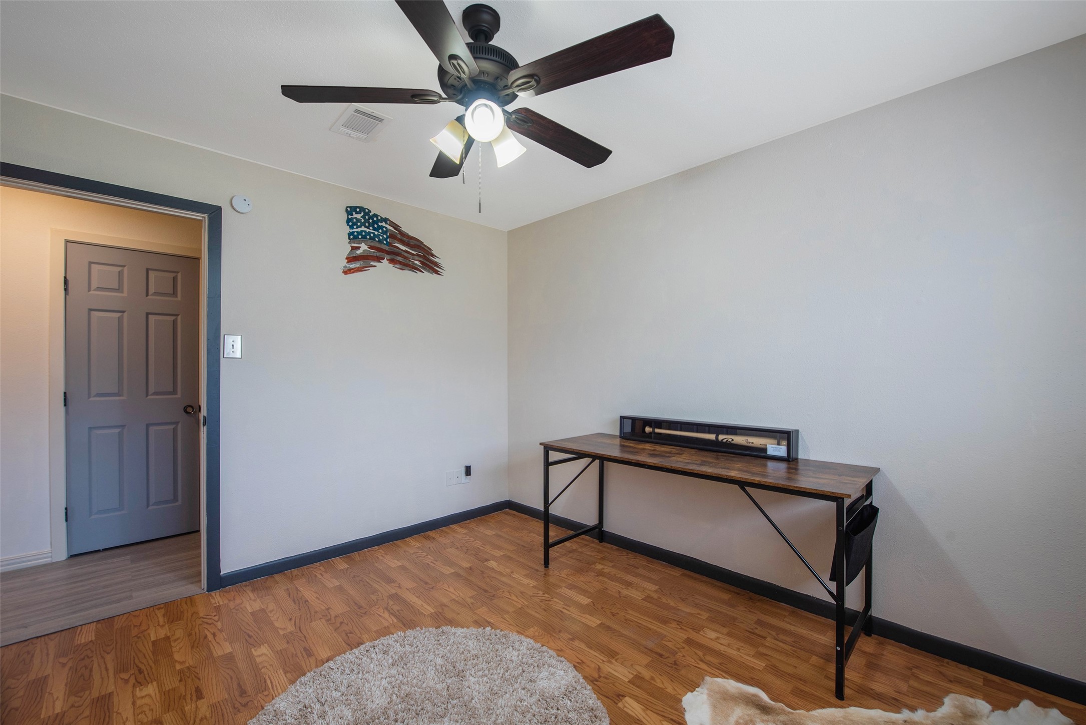 12998 Rocky Road Conroe, TX 77306 - Photo 38 of 50 a view of room with workspace and wooden floor