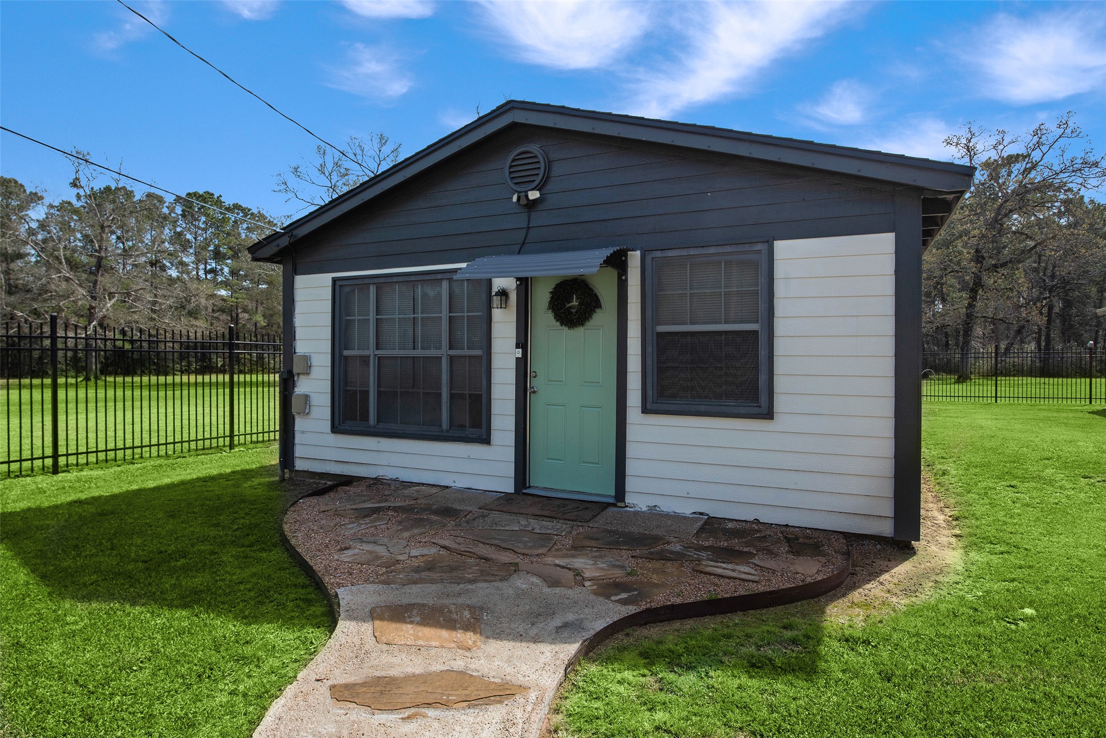 12998 Rocky Road Conroe, TX 77306 - Photo 39 of 50 a front view of a house with a yard