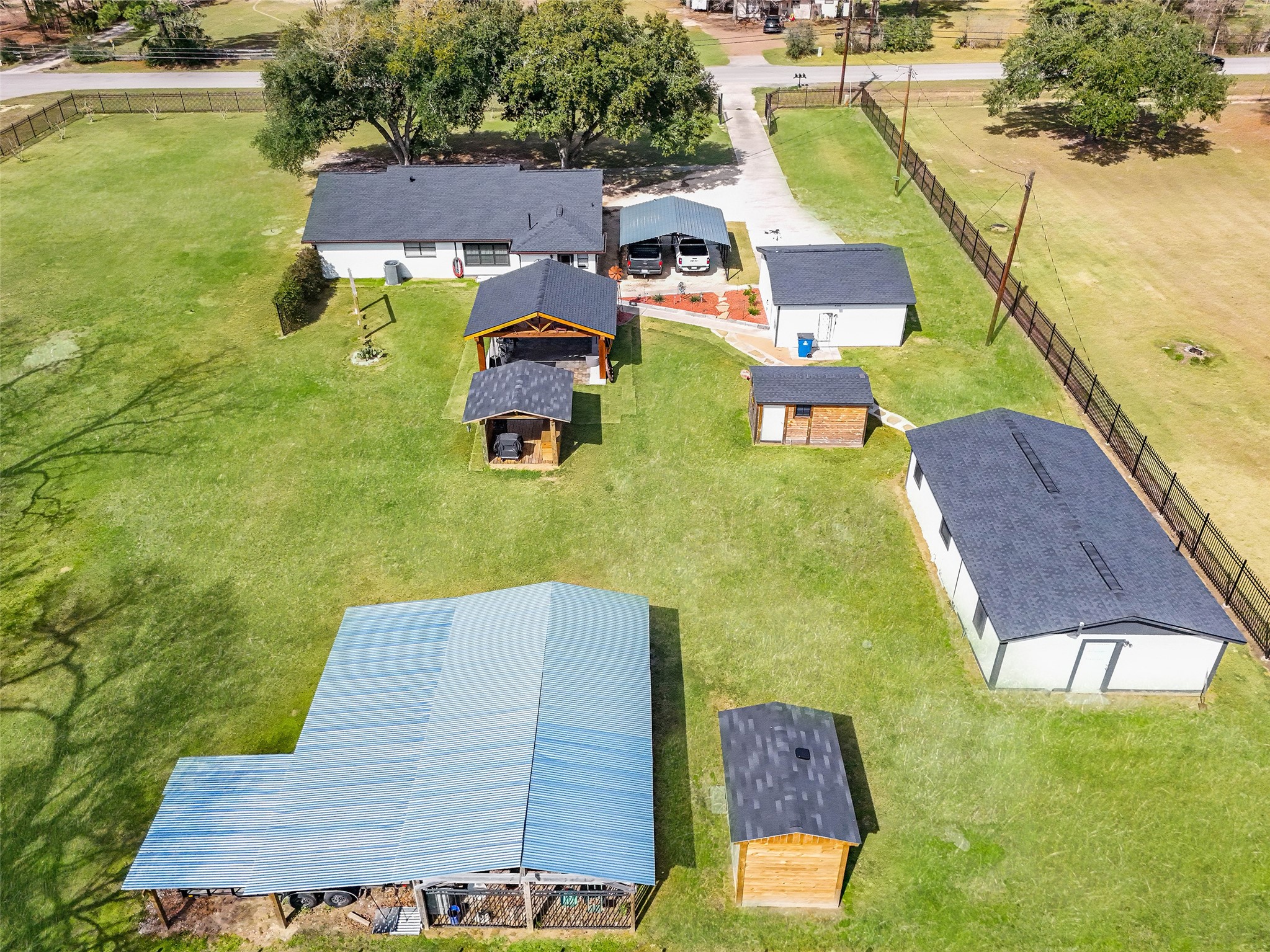 12998 Rocky Road Conroe, TX 77306 - Photo 4 of 50 an aerial view of a house with swimming pool and ocean view