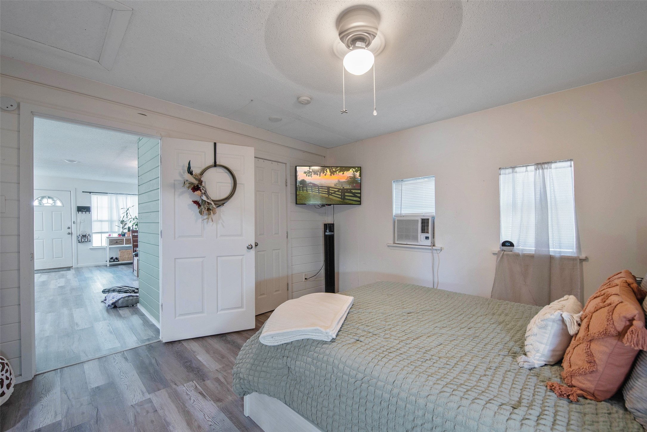 12998 Rocky Road Conroe, TX 77306 - Photo 43 of 50 a bedroom with a bed and a chandelier