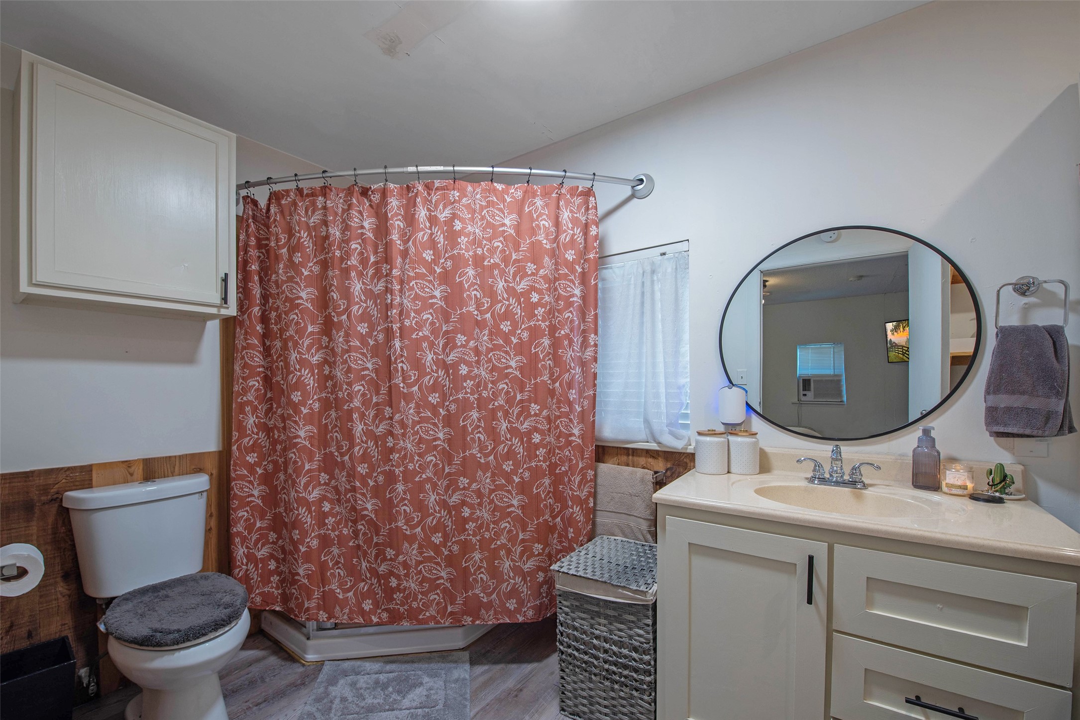 12998 Rocky Road Conroe, TX 77306 - Photo 44 of 50 a bathroom with a sink mirror vanity and toilet