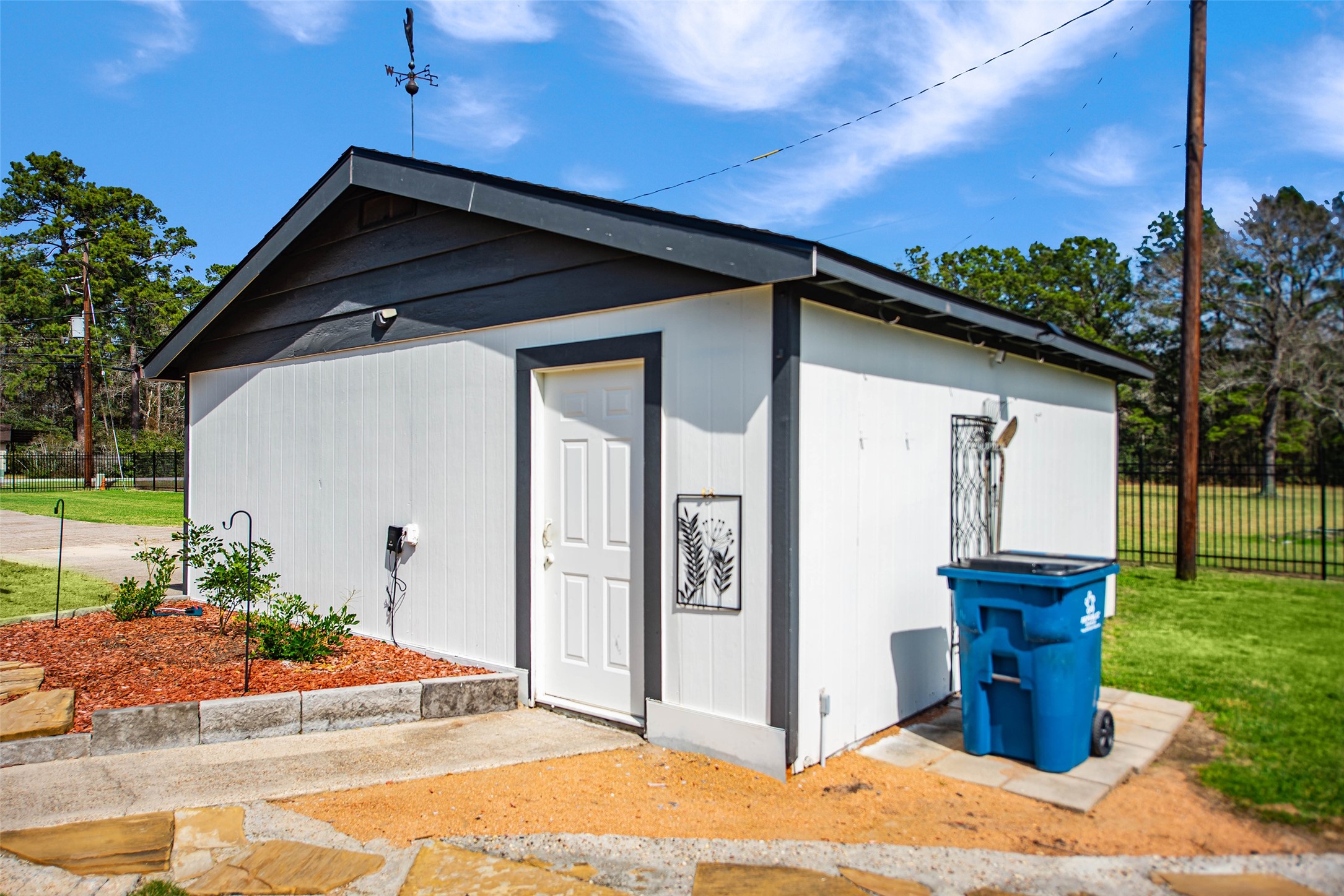 12998 Rocky Road Conroe, TX 77306 - Photo 50 of 50 a front view of a house with garden