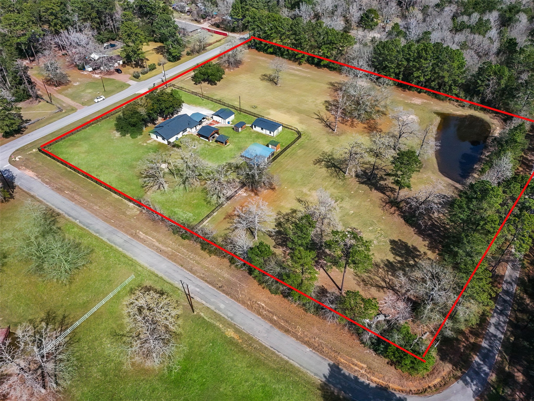 12998 Rocky Road Conroe, TX 77306 - Photo 6 of 50 a view of a backyard with plants