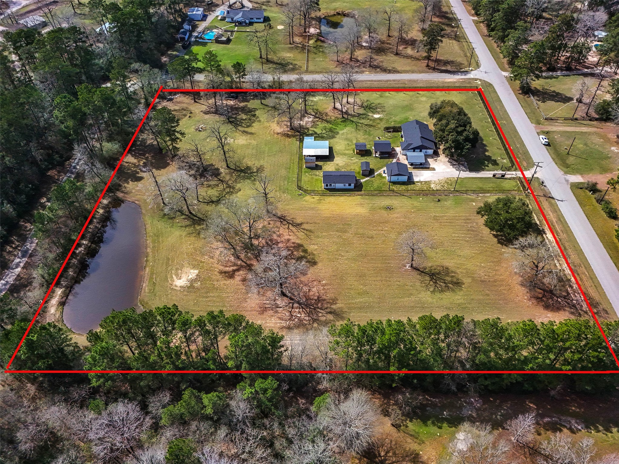 12998 Rocky Road Conroe, TX 77306 - Photo 8 of 50 an aerial view of a house with a yard and lake view