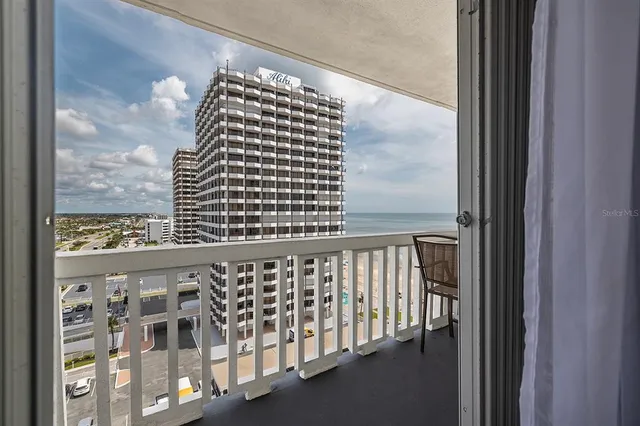 a view of balcony with wooden floor