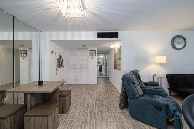 a living room with furniture a window and a table