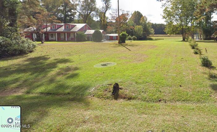 2391 Bill Hooks Road Whiteville, NC 28472 - Photo 10 of 39 From the road looking down the property line on the right