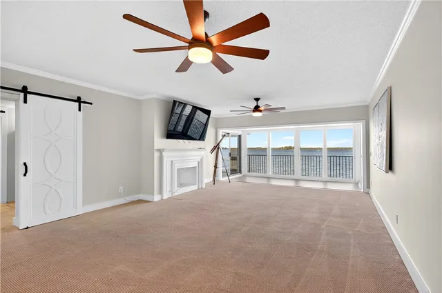 a view of livingroom with a flat screen tv and a ceiling fan