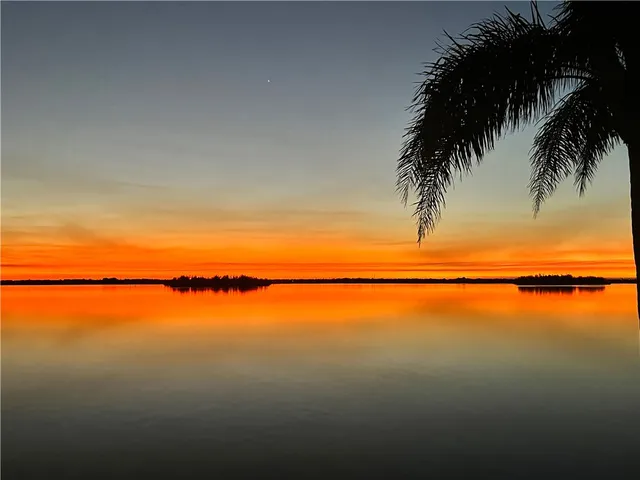 an aerial view of a house with outdoor space