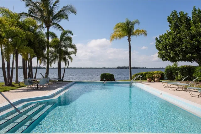 an aerial view of a house with a lake view