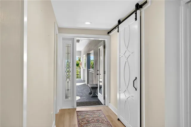 a bathroom with a glass door shower and a sink