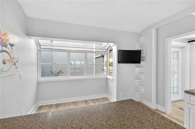 a view of livingroom with furniture and flat screen tv