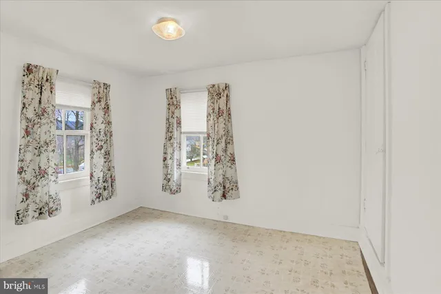 an empty room with a hallway