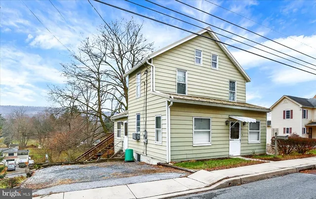 a front view of a house with a garage