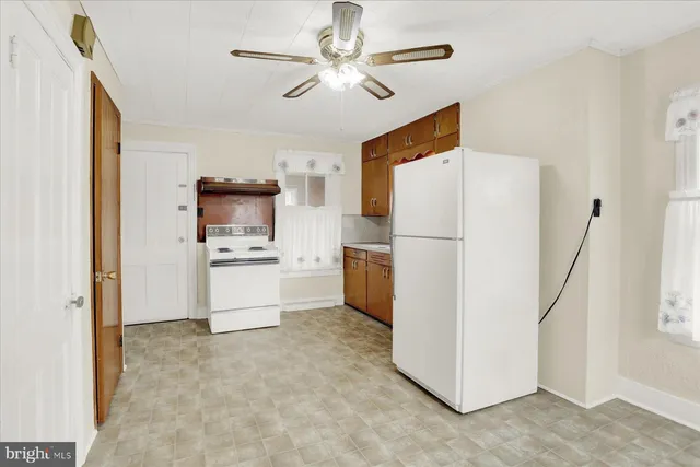 a utility room with sink dryer and washer