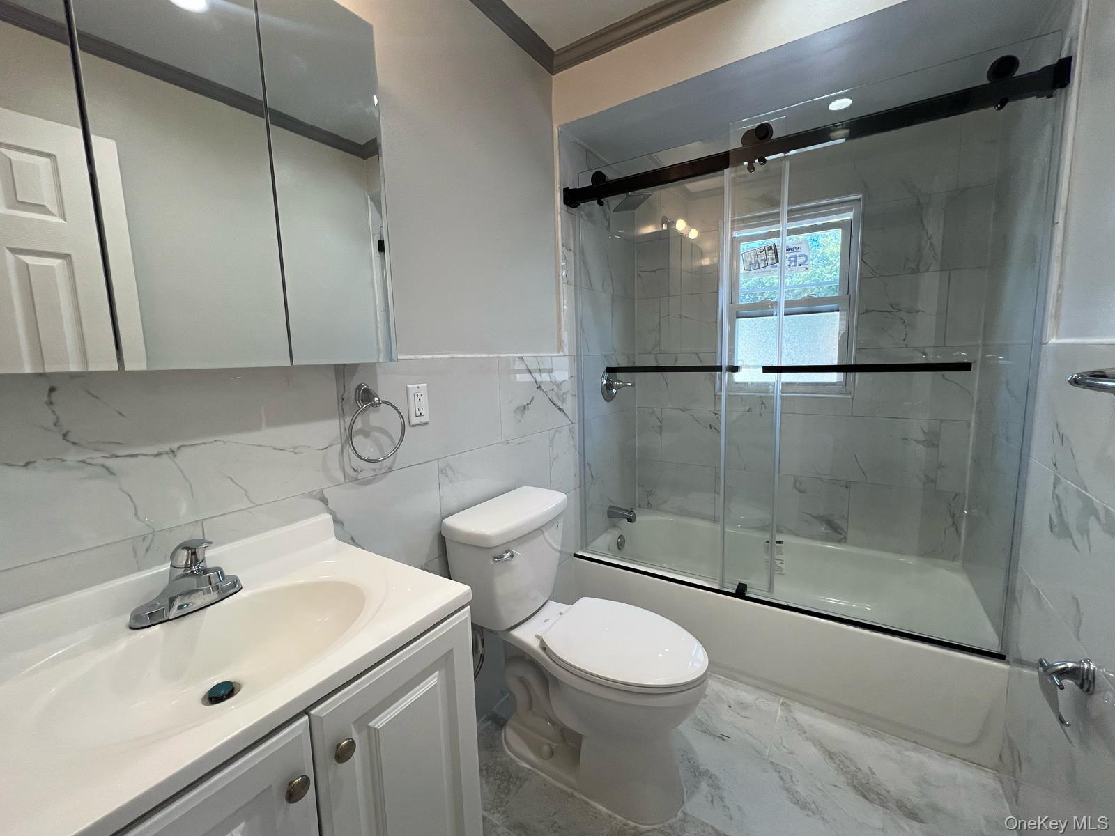 153-33 119th Road Queens, NY 11434 - Photo 4 of 9 a bathroom with a sink toilet and shower