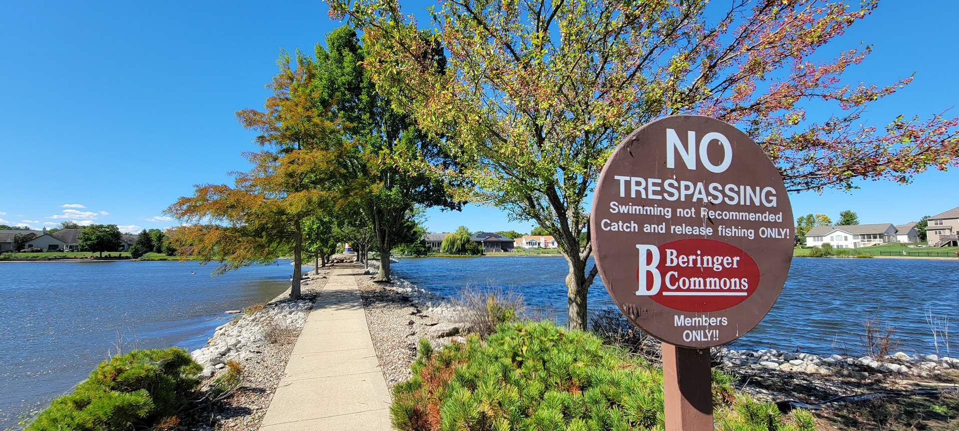 703 North Beacon Hill Circle Urbana, IL 61802 - Photo 2 of 10 a sign that is on the brick wall