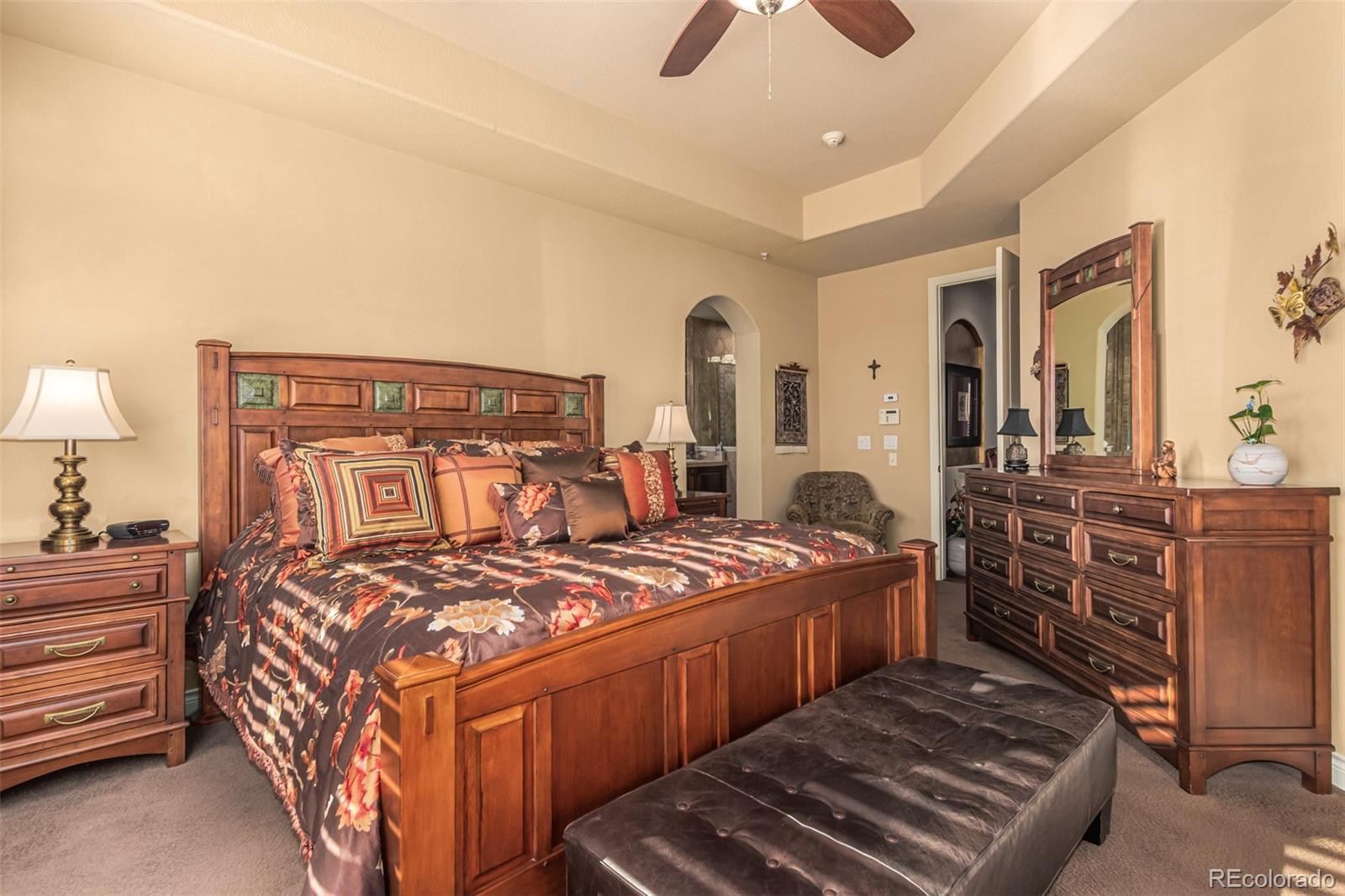 4318 Chateau Ridge Road Castle Rock, CO 80108 - Photo 21 of 50 a bedroom with bed and wooden floor