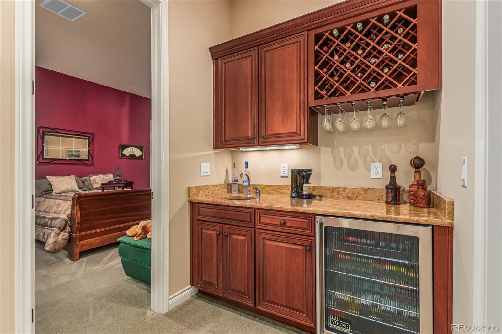 4318 Chateau Ridge Road Castle Rock, CO 80108 - Photo 29 of 50 a kitchen with stainless steel appliances a stove and cabinets