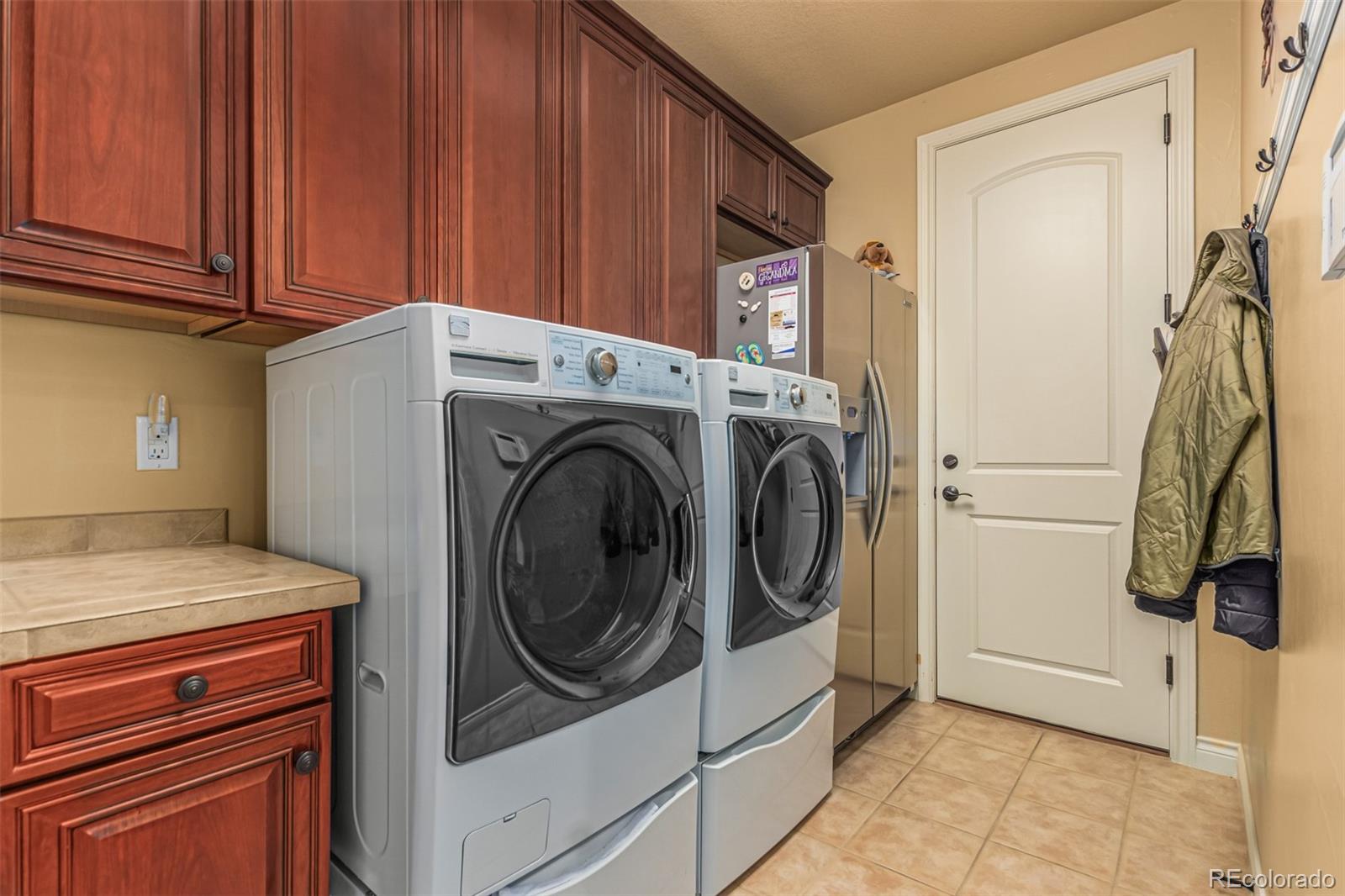 4318 Chateau Ridge Road Castle Rock, CO 80108 - Photo 40 of 50 a utility room with dryer and washer