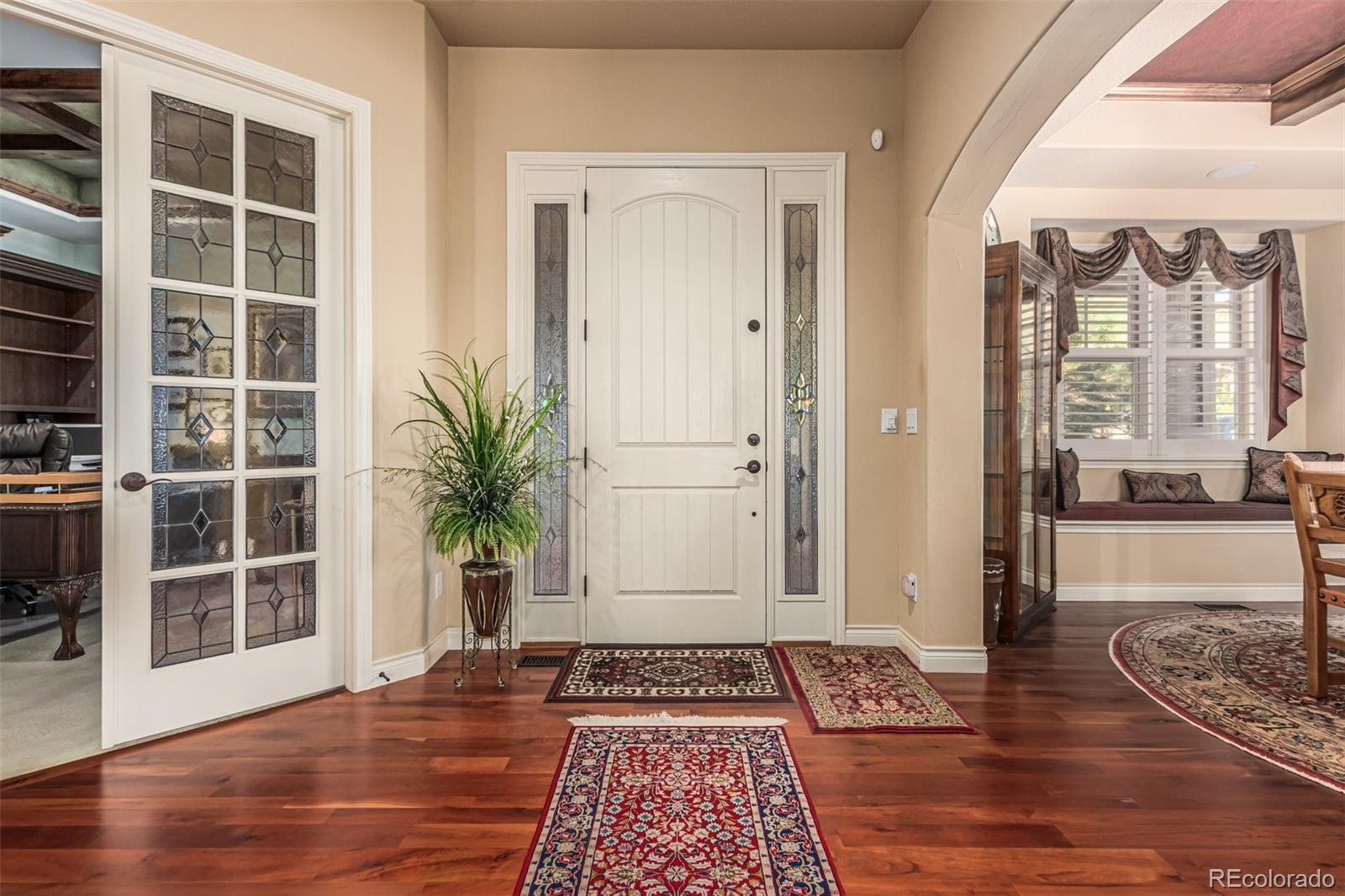 4318 Chateau Ridge Road Castle Rock, CO 80108 - Photo 5 of 50 a view of a entryway door with wooden floor