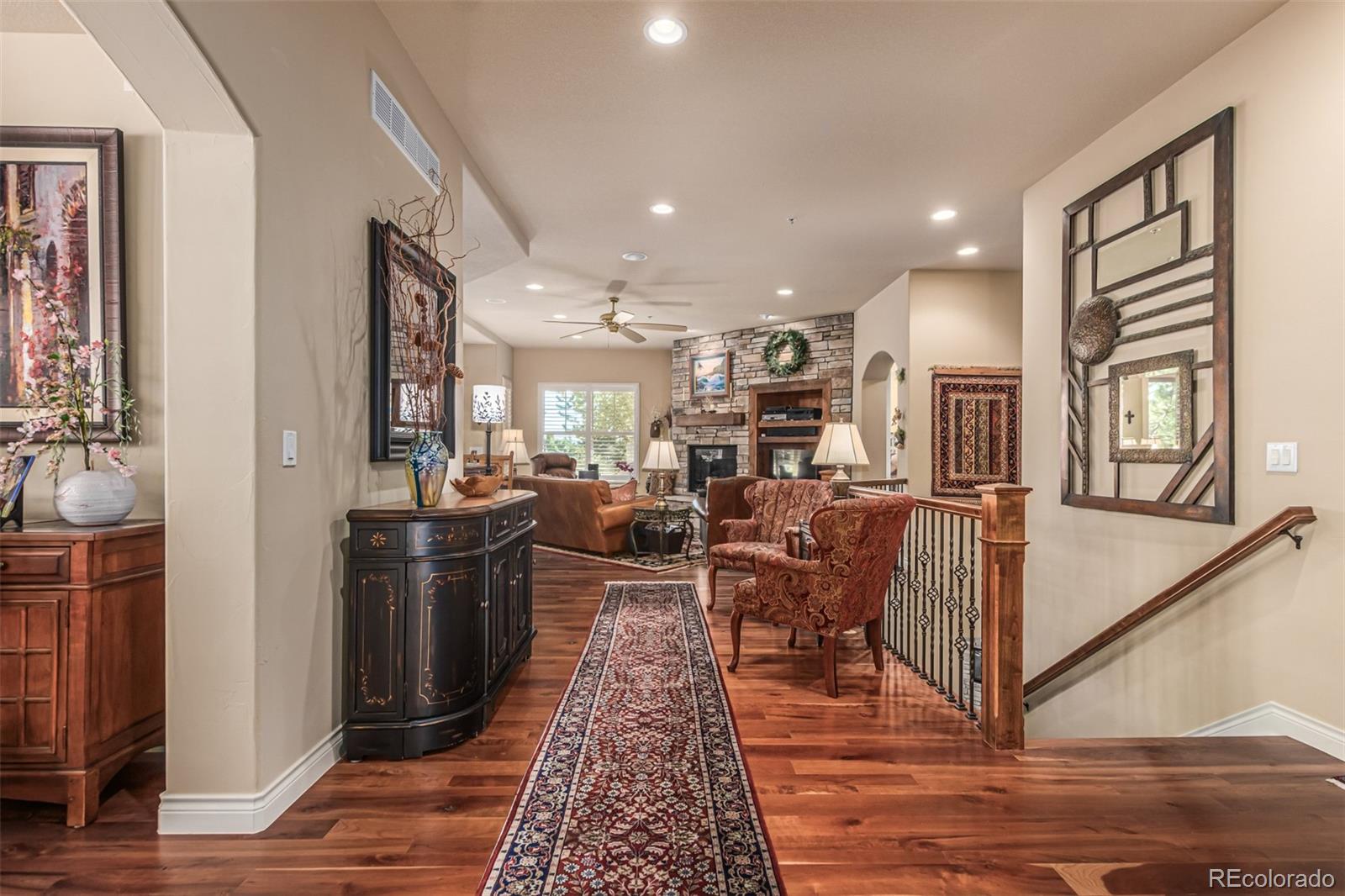 4318 Chateau Ridge Road Castle Rock, CO 80108 - Photo 6 of 50 a living room with stainless steel appliances granite countertop furniture wooden floor and a view of kitchen