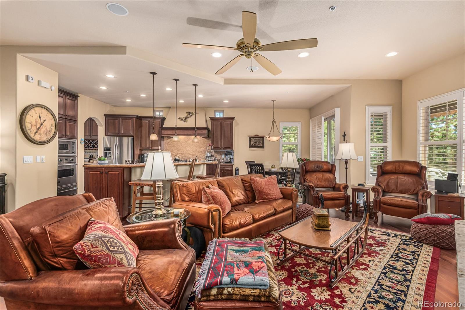 4318 Chateau Ridge Road Castle Rock, CO 80108 - Photo 8 of 50 a living room with furniture and a clock