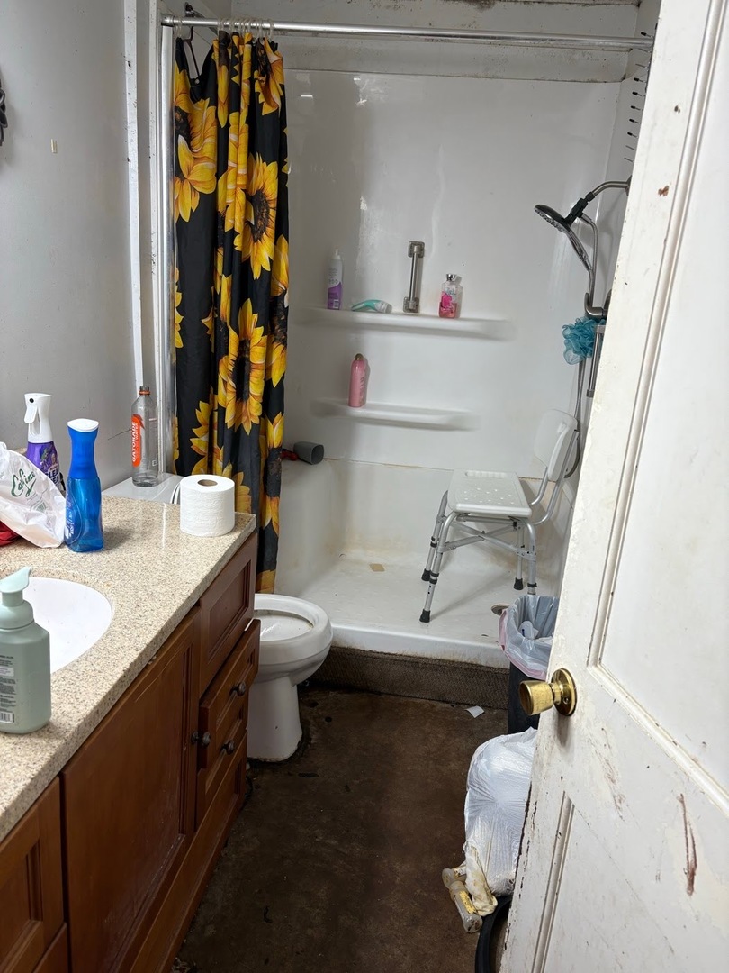 235 East Madison Street Paris, IL 61944 - Photo 3 of 3 a bathroom with a sink vanity granite and toilet