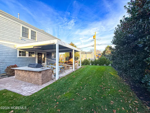 a outdoor space with patio the couches and a dining table with garden view