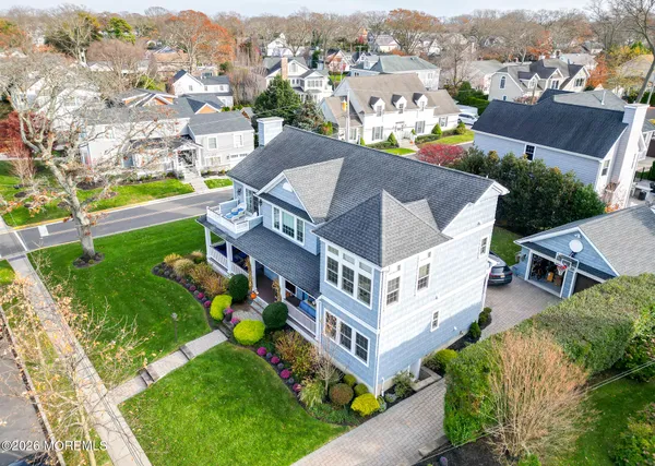 an aerial view of residential house with outdoor space and pool