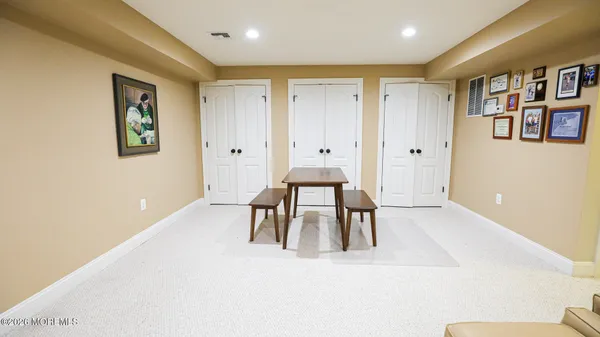 a living room with furniture window and wooden floor