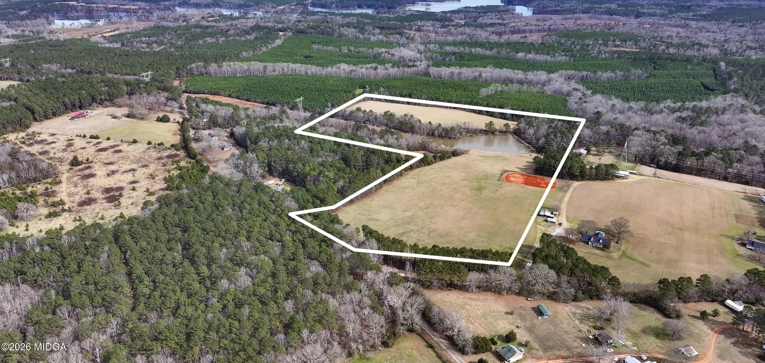 0 Colvin Road Forsyth, GA 31029 - Photo 21 of 23 an aerial view of a house with outdoor space and a lake view in back
