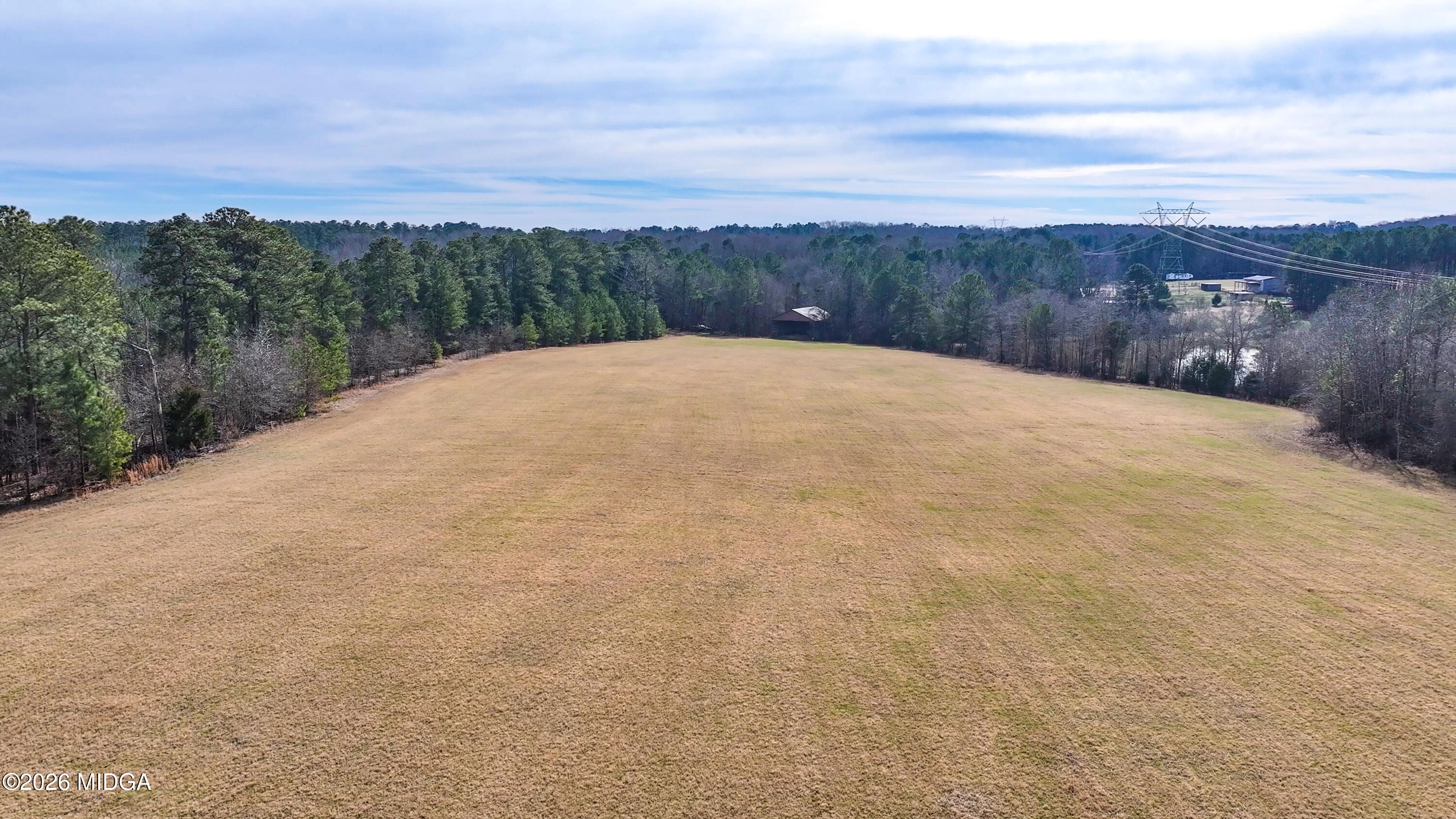 0 Colvin Road Forsyth, GA 31029 - Photo 4 of 23 a view of a dry yard with mountains in the background