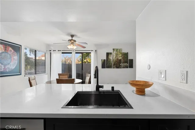 a kitchen with stainless steel appliances a refrigerator and a stove top oven