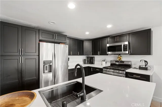 a livingroom with workspace and a window