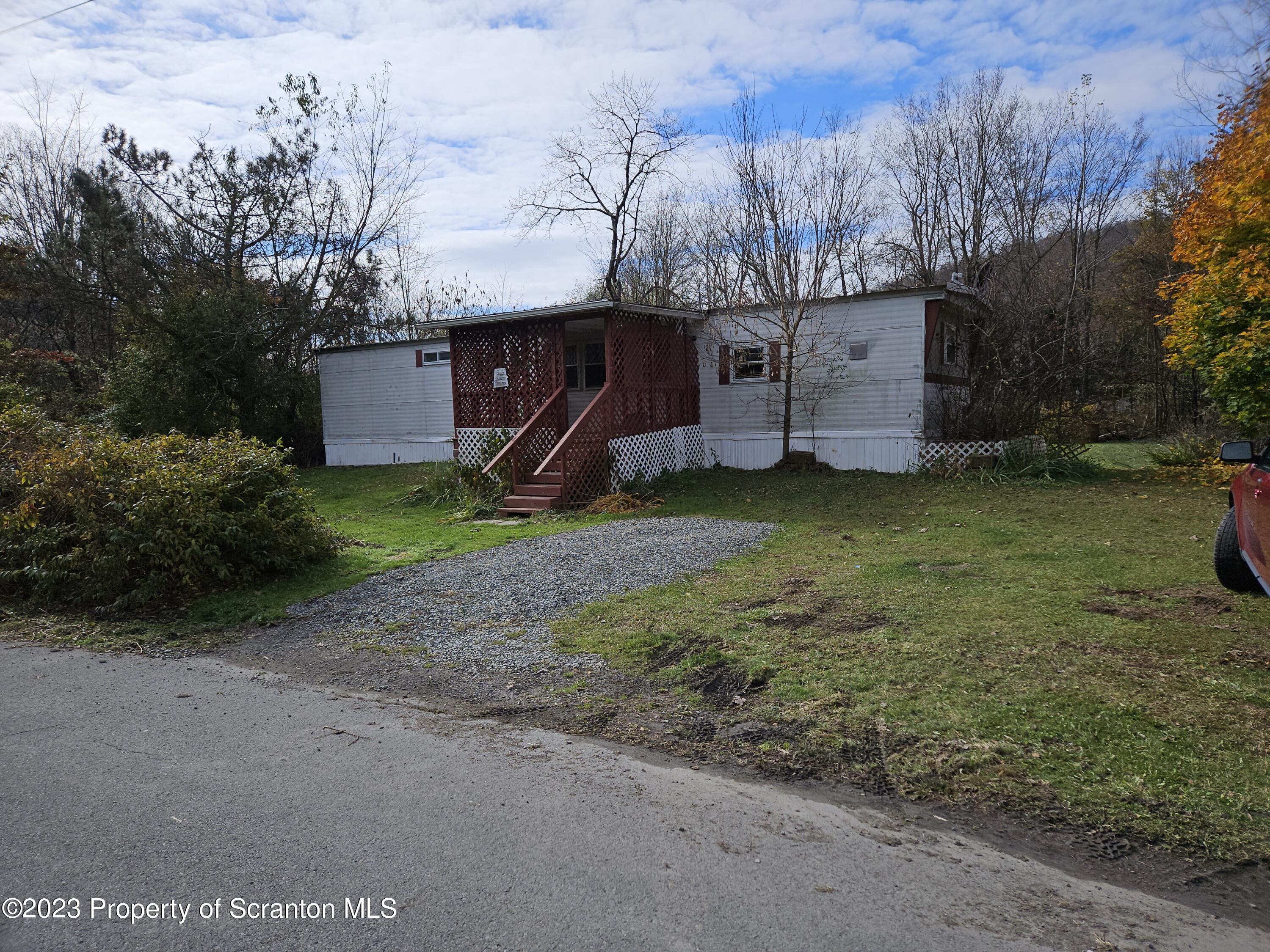 a view of a barn in the middle of a yard