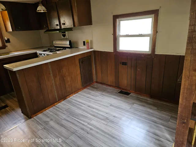 a kitchen with stainless steel appliances a refrigerator and a sink