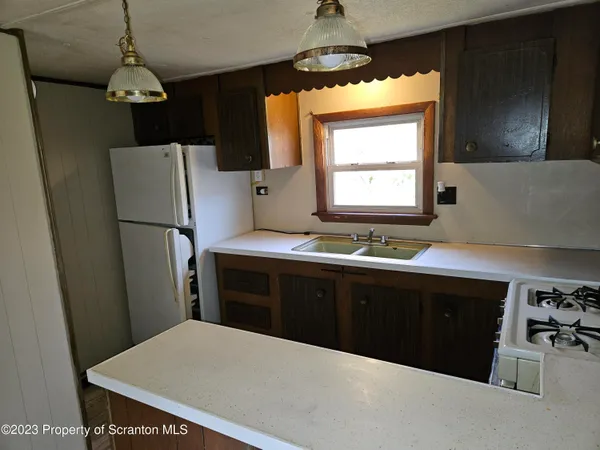 a bathroom with a shower and a sink