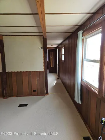 a kitchen with refrigerator and window