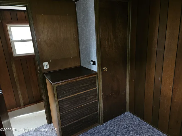 a view of an empty room and a window