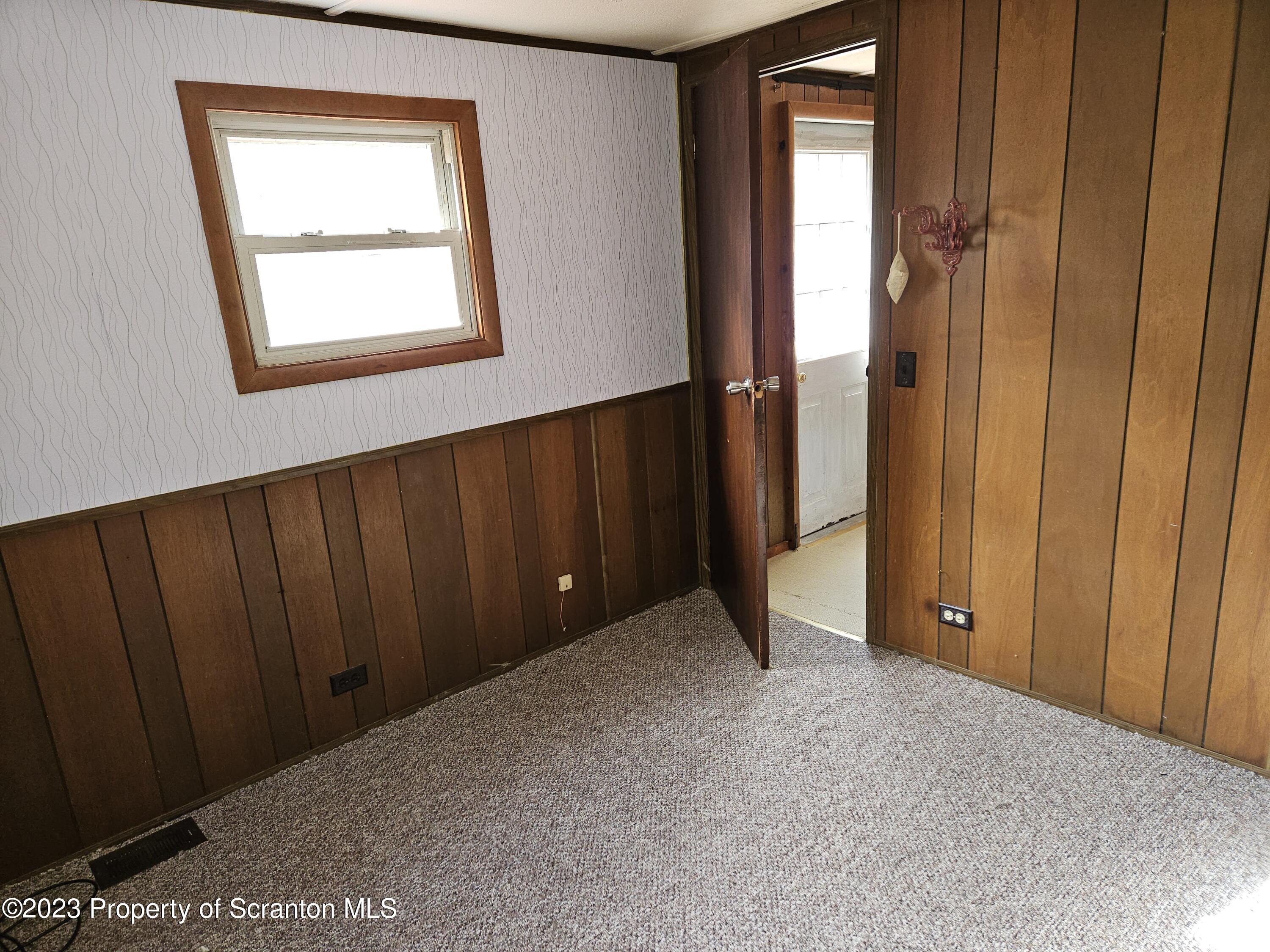 65 South Center Street Hop Bottom, PA 18824 - Photo 26 of 28 an empty room with windows and closet