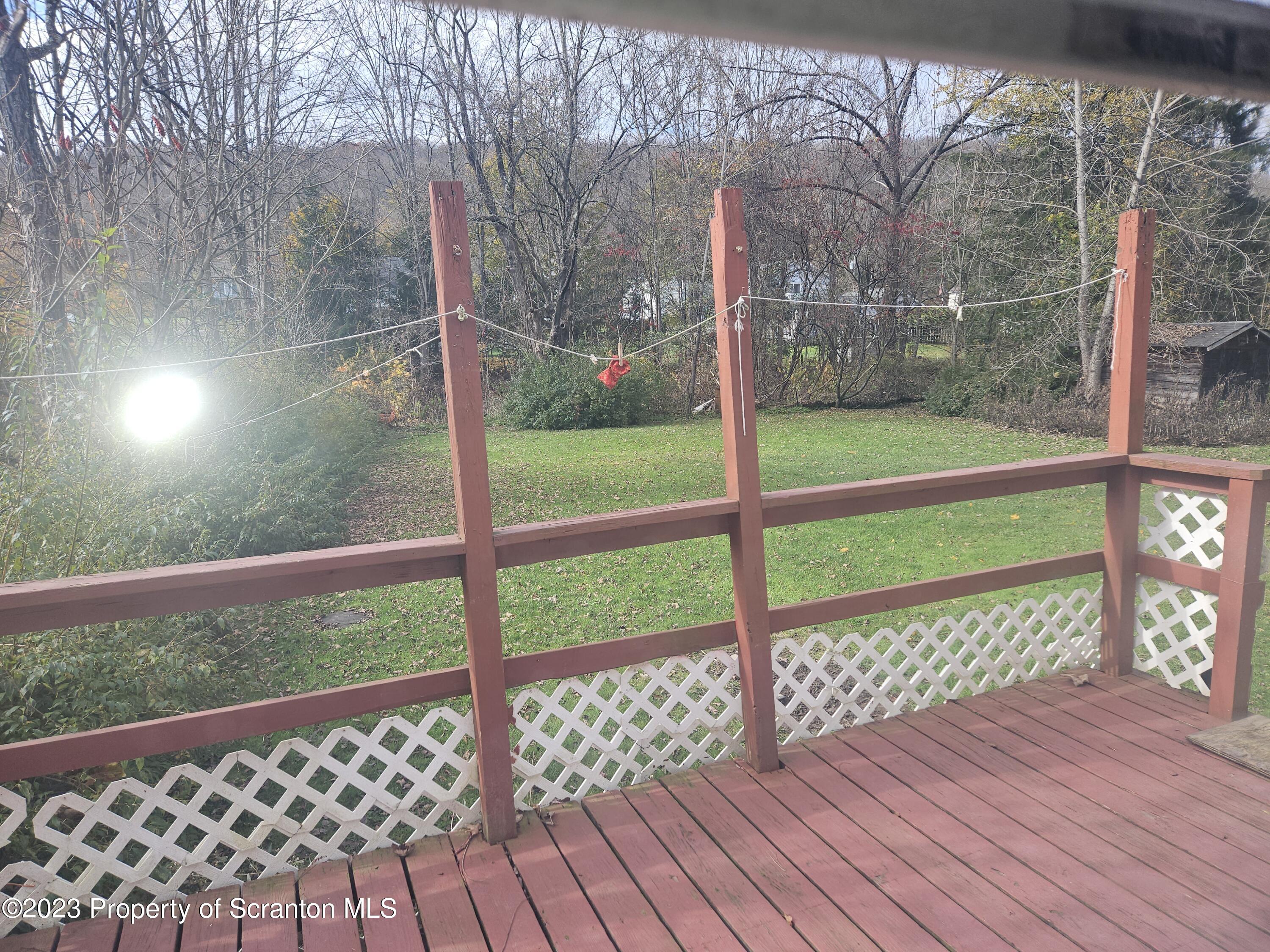 65 South Center Street Hop Bottom, PA 18824 - Photo 28 of 28 a view of a yard with wooden fence