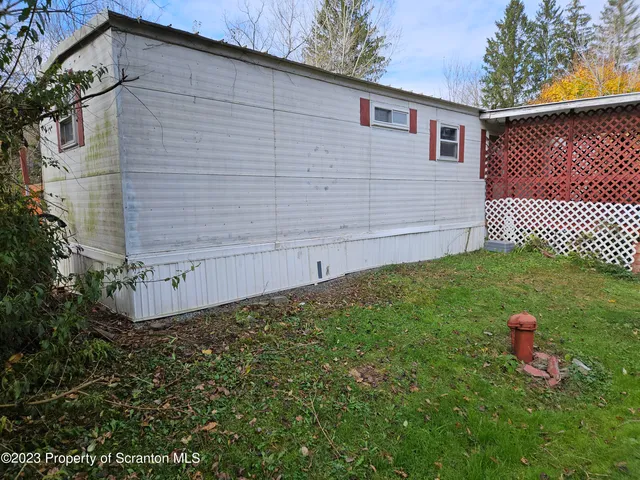 a view of a backyard of the house