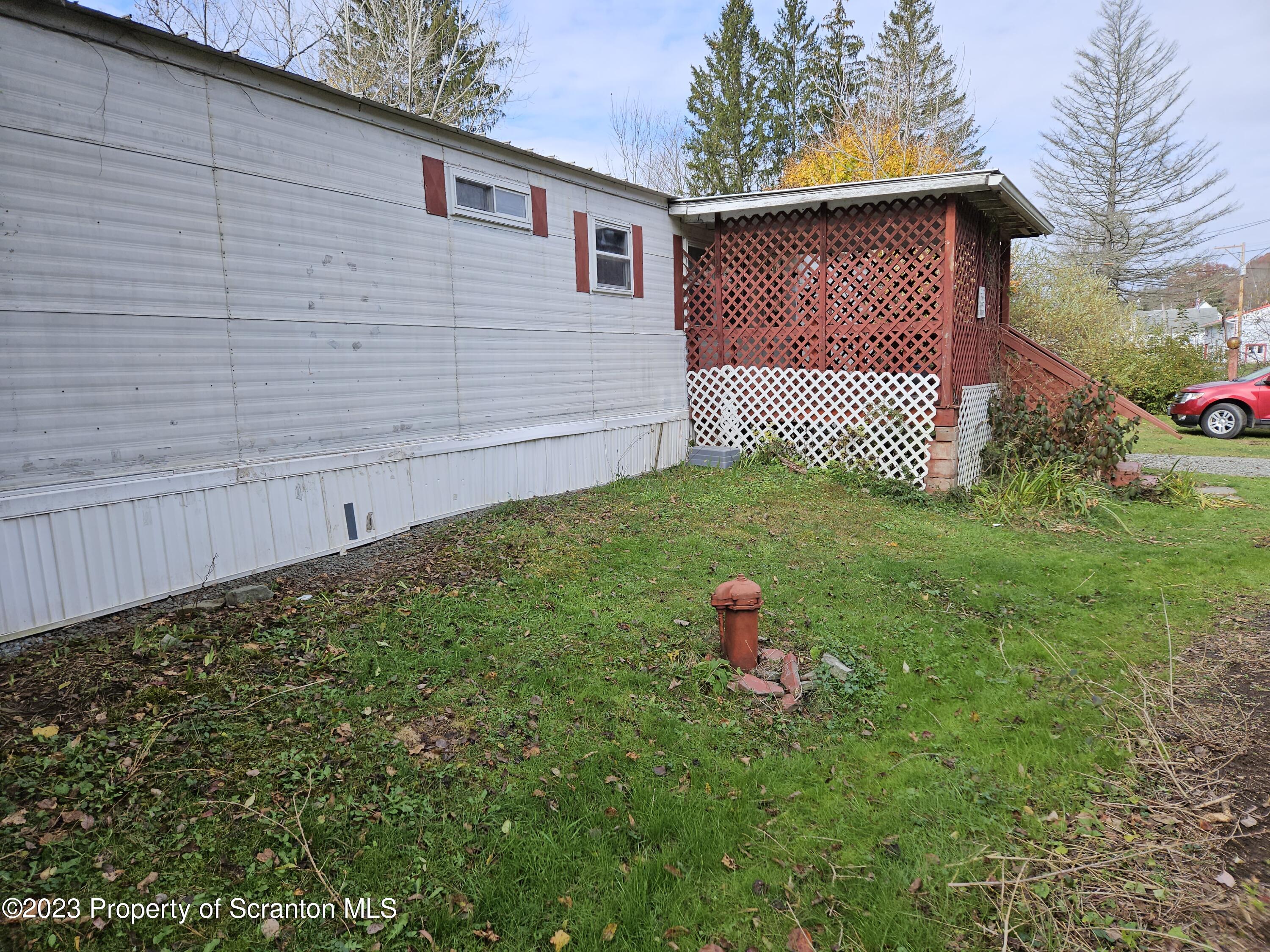 65 South Center Street Hop Bottom, PA 18824 - Photo 4 of 28 a backyard of a house with lots of green space
