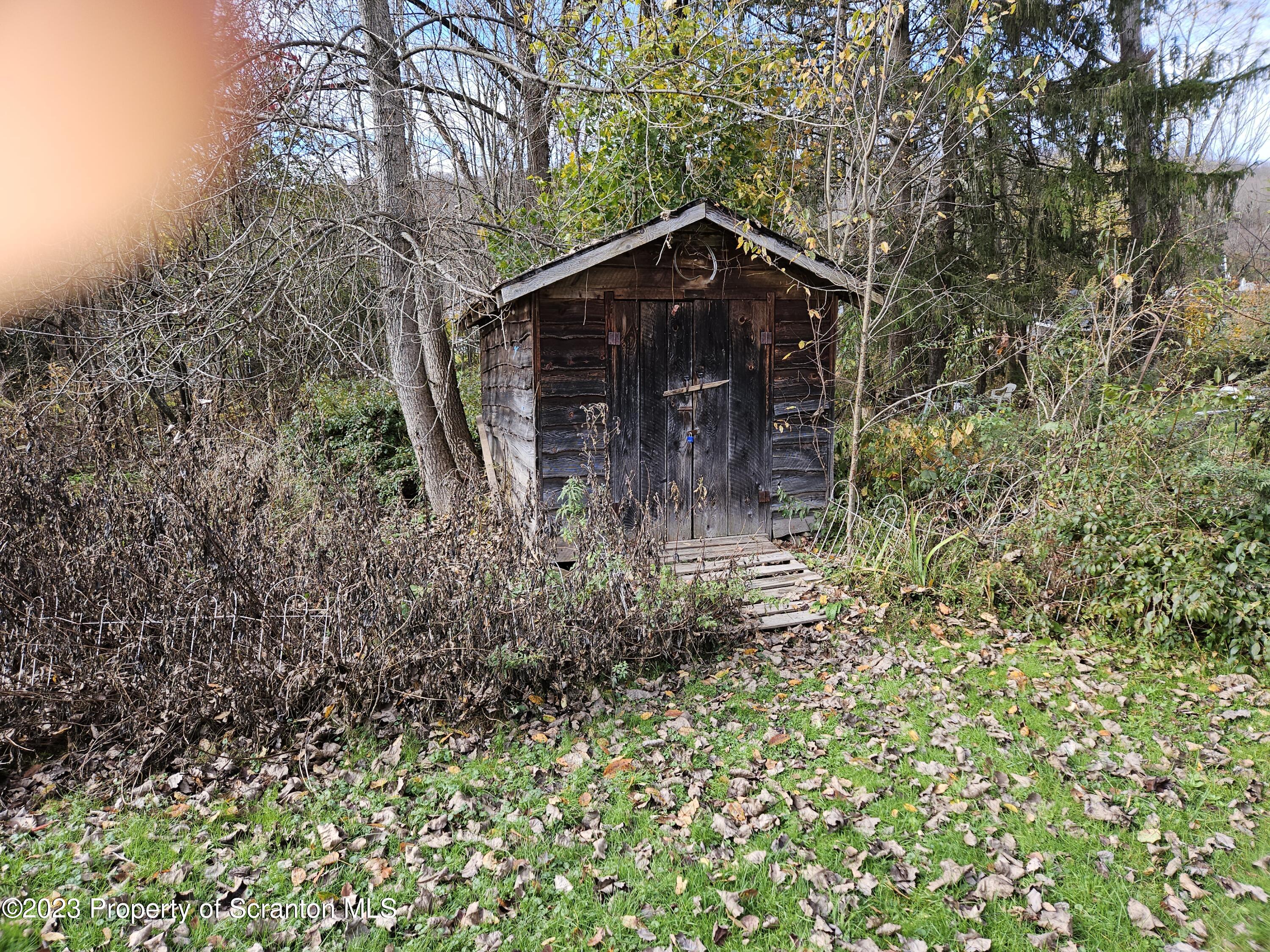 65 South Center Street Hop Bottom, PA 18824 - Photo 5 of 28 a brick house with lots of trees