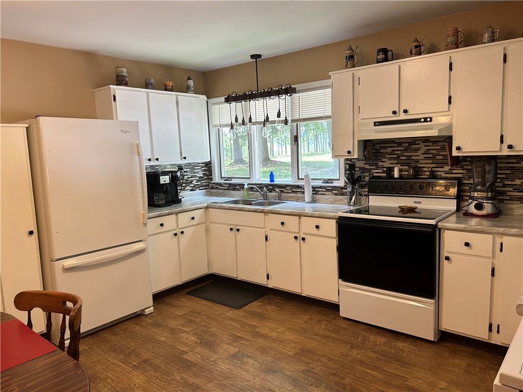 240 Martin Road Scottdale, PA 15683 - Photo 16 of 16 a kitchen with granite countertop white cabinets and white appliances