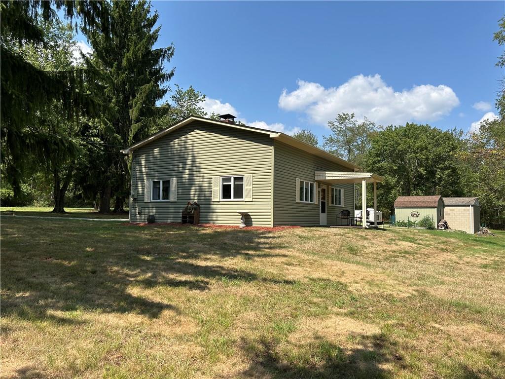 240 Martin Road Scottdale, PA 15683 - Photo 3 of 16 a view of a house with backyard and trees