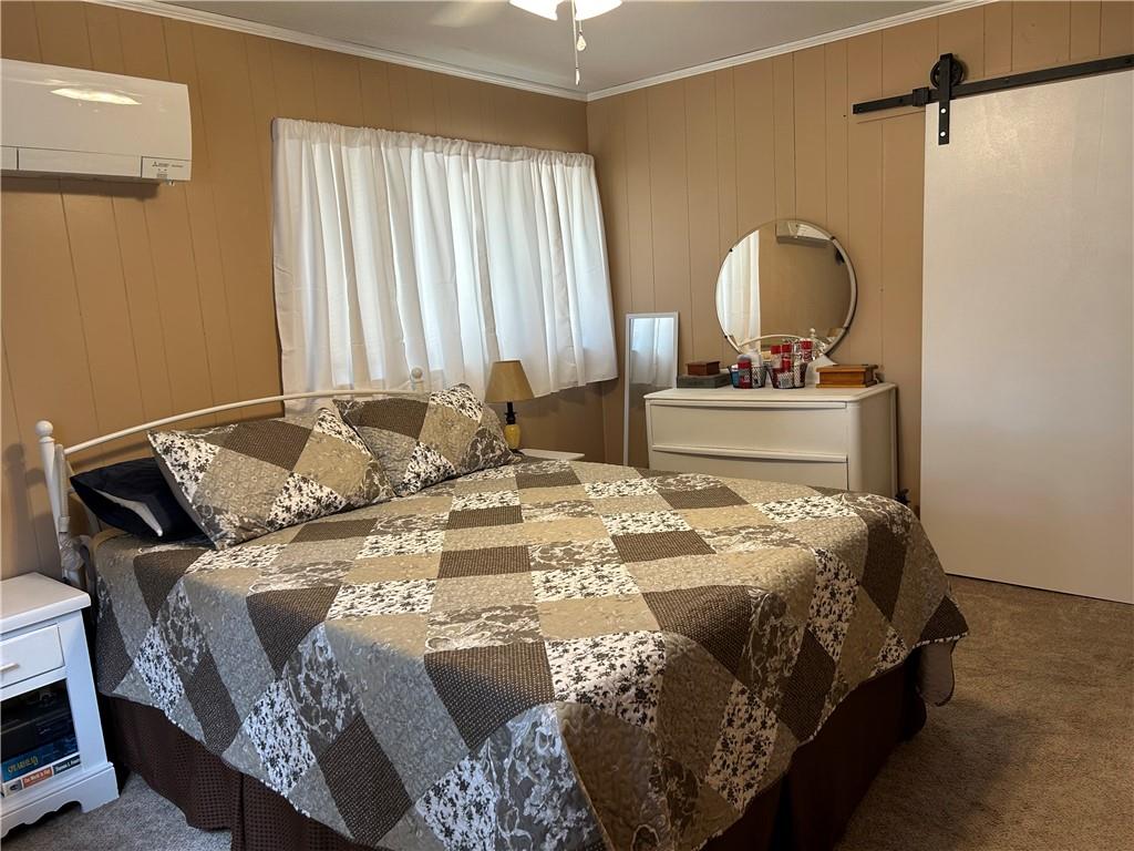 240 Martin Road Scottdale, PA 15683 - Photo 7 of 16 a bedroom with a bed and dresser